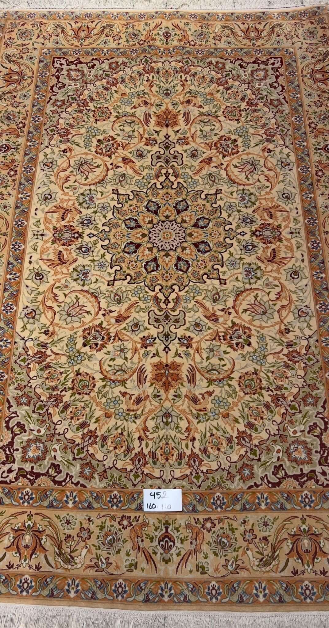 "Handmade vintage Persian rug with intricate floral design from Isfahan, Iran."